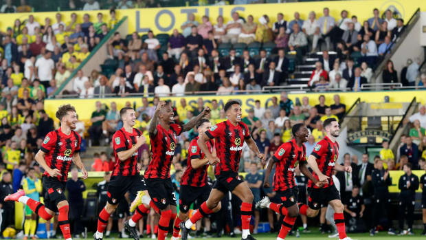 Bournemouth's players pictured celebrating after beating Norwich City in a penalty shootout in the second round of the EFL Cup in August 2022